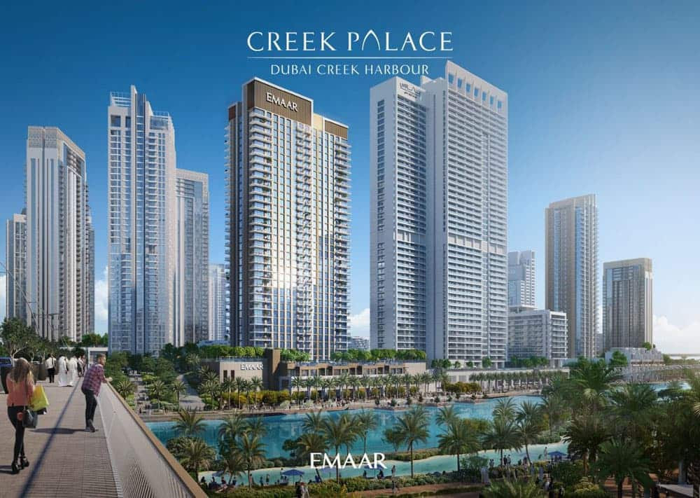 קו רקיע מודרני של מגדלי מגורים גבוהים בעלי קירות זכוכית ב”קריק פאלאס”, נמל קריק דובאי. אנשים הולכים על גשר מעל גנים מעוצבים ועצי דקל, כשברקע נראים דירות יוקרה ולוגו חברת “אמאר”. מעל, שמיים כחולים וצלולים. קו רקיע מודרני של מגדלי מגורים גבוהים בעלי קירות זכוכית ב"קריק פאלאס", נמל קריק דובאי. אנשים הולכים על גשר מעל גנים מעוצבים ועצי דקל, כשברקע נראים דירות יוקרה ולוגו חברת "אמאר". מעל, שמיים כחולים וצלולים.