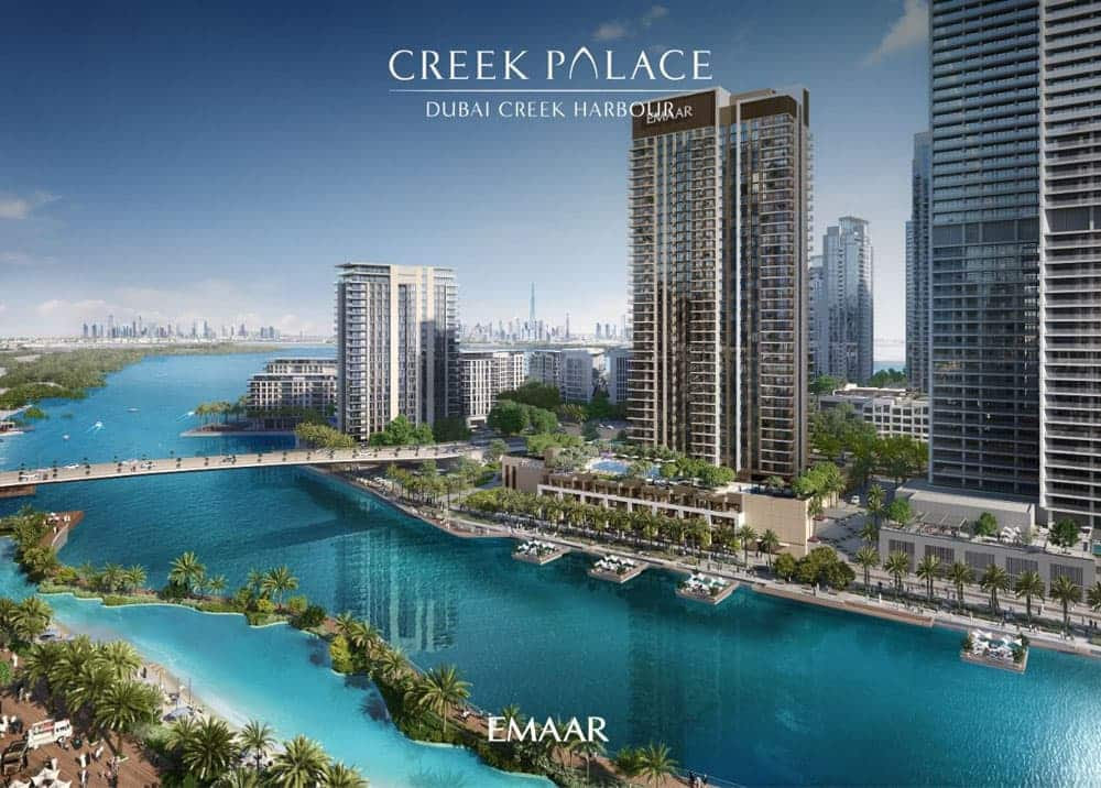 נוף של נמל דובאי קריק (Dubai Creek Harbour) מציג גורדי שחקים מודרניים, מים בצבע טורקיז וגשר. צמחייה עבותה מקיפה את דירות היוקרה. על התמונה כתוב: “Creek Palace Dubai Creek Harbour” ו-“Emaar”. נוף של נמל דובאי קריק (Dubai Creek Harbour) מציג גורדי שחקים מודרניים, מים בצבע טורקיז וגשר. צמחייה עבותה מקיפה את דירות היוקרה. על התמונה כתוב: "Creek Palace Dubai Creek Harbour" ו-"Emaar".