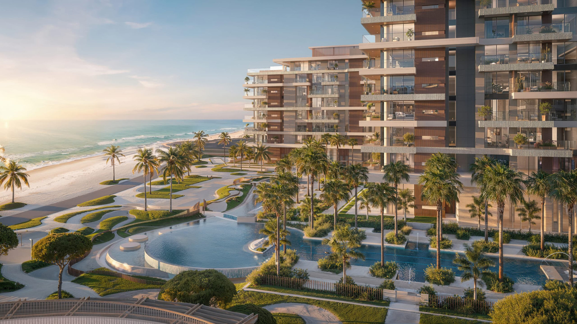 ELLINGTON COVE הוא מתחם מגורים מודרני על חוף הים, הכולל מרפסות מזכוכית, עצי דקל, גנים מעוצבים ואזור בריכה גדול המשקיף על האוקיינוס בשעת השקיעה. ELLINGTON COVE הוא מתחם מגורים מודרני על חוף הים, הכולל מרפסות מזכוכית, עצי דקל, גנים מעוצבים ואזור בריכה גדול המשקיף על האוקיינוס בשעת השקיעה.