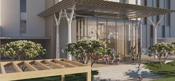 כניסה מודרנית לבניין “אלינגטון האוס” בדובאי הילס, הכוללת דלתות זכוכית, סככת מתכת ומדרגות רחבות. עצים קטנים עם פרחים לבנים ופרגולה מעץ משדרגים את שטח הגינון שבחזית. כניסה מודרנית לבניין "אלינגטון האוס" בדובאי הילס, הכוללת דלתות זכוכית, סככת מתכת ומדרגות רחבות. עצים קטנים עם פרחים לבנים ופרגולה מעץ משדרגים את שטח הגינון שבחזית.