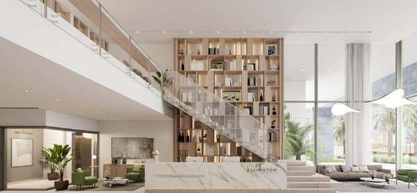 בלובי המודרני והמרווח של Ellington House בדובאי הילס ניתן למצוא קיר ספרים גדול מעץ, גרם מדרגות מזכוכית, דלפק קבלה משיש שעליו הכיתוב “Ellington”, צמחים ירוקים וחלונות מהרצפה עד התקרה המציפים את החלל באור טבעי. בלובי המודרני והמרווח של Ellington House בדובאי הילס ניתן למצוא קיר ספרים גדול מעץ, גרם מדרגות מזכוכית, דלפק קבלה משיש שעליו הכיתוב "Ellington", צמחים ירוקים וחלונות מהרצפה עד התקרה המציפים את החלל באור טבעי.