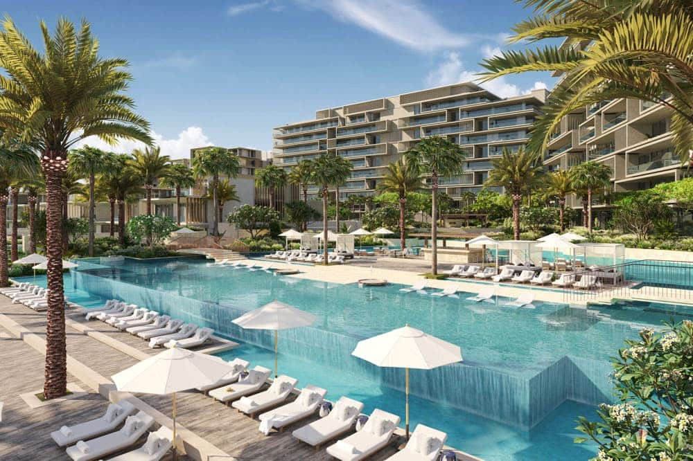 אתר הנופש היוקרתי Six Senses בפאלם ג’ומיירה כולל מבנים מודרניים בני מספר קומות, עצי דקל מתנדנדים ובריכת אינסוף מרהיבה המדורגת במפלסים, המוקפת במיטות שיזוף ושמשיות לבנות ביום שטוף שמש. אתר הנופש היוקרתי Six Senses בפאלם ג'ומיירה כולל מבנים מודרניים בני מספר קומות, עצי דקל מתנדנדים ובריכת אינסוף מרהיבה המדורגת במפלסים, המוקפת במיטות שיזוף ושמשיות לבנות ביום שטוף שמש.