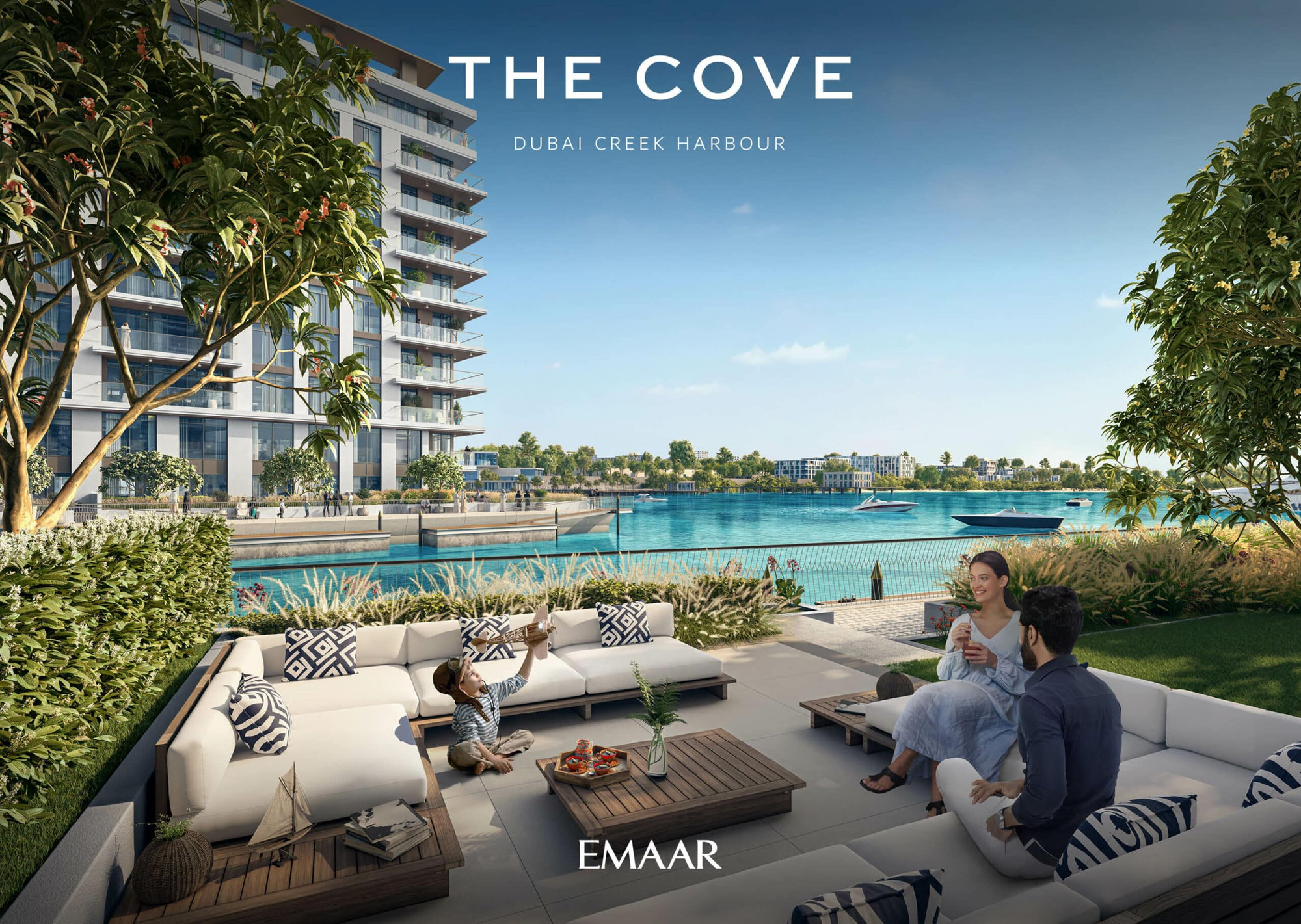 משפחה נחה במרפסת חיצונית מודרנית עם ספות לבנות המשקיפה על קו המים, כשברקע נראים סירות ובניין דירות עכשווי. הכיתוב: THE COVE Dubai Creek Harbour EMAAR. משפחה נחה במרפסת חיצונית מודרנית עם ספות לבנות המשקיפה על קו המים, כשברקע נראים סירות ובניין דירות עכשווי. הכיתוב: THE COVE Dubai Creek Harbour EMAAR.