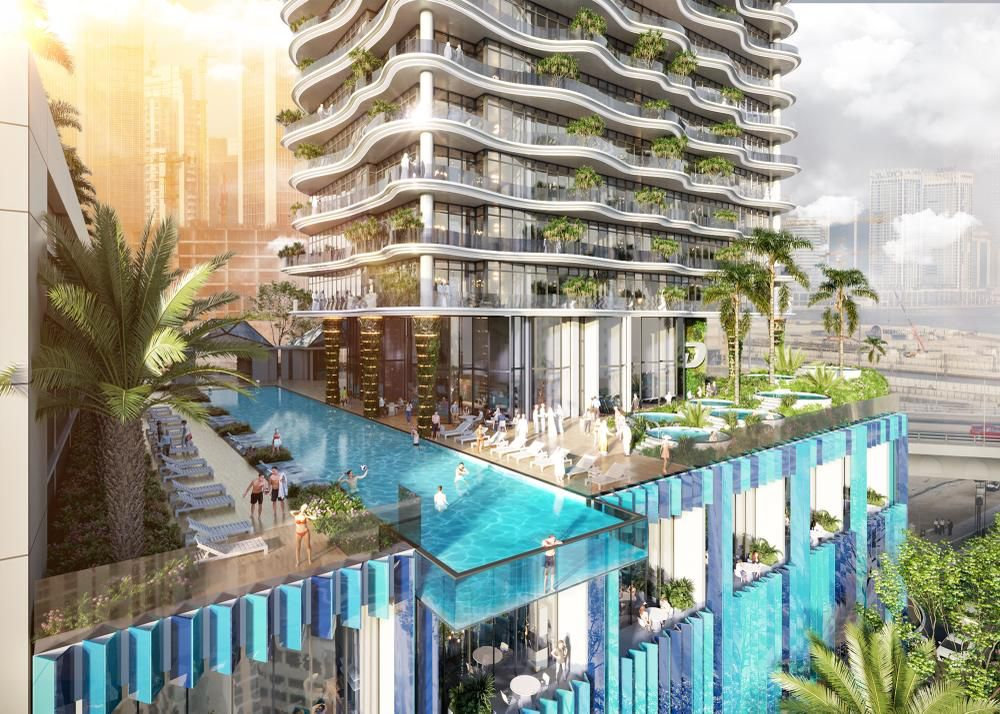 בריכת גג מפוארת במגדל CHIC Tower מבית De Grisogono, שבה אנשים שוחים ונחים על כיסאות נוח בין עצי דקל, במגדל מודרני בדובאי עם מרפסות מעוגלות וצמחייה, המשקיף על נוף עירוני מרהיב. בריכת גג מפוארת במגדל CHIC Tower מבית De Grisogono, שבה אנשים שוחים ונחים על כיסאות נוח בין עצי דקל, במגדל מודרני בדובאי עם מרפסות מעוגלות וצמחייה, המשקיף על נוף עירוני מרהיב.