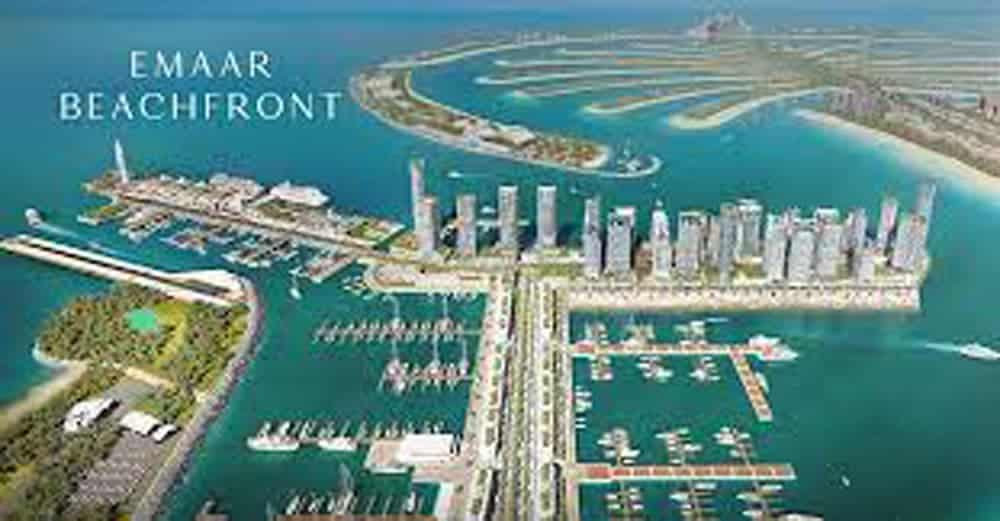 מבט אווירי על אזור החוף של Emaar, המציג את קו הרקיע האיקוני של מגדלים מודרניים, מרינה תוססת עם סירות וגשר המחבר ליבשת, והכל על רקע המרהיב של פאלם ג’ומיירה. מבט אווירי על אזור החוף של Emaar, המציג את קו הרקיע האיקוני של מגדלים מודרניים, מרינה תוססת עם סירות וגשר המחבר ליבשת, והכל על רקע המרהיב של פאלם ג'ומיירה.