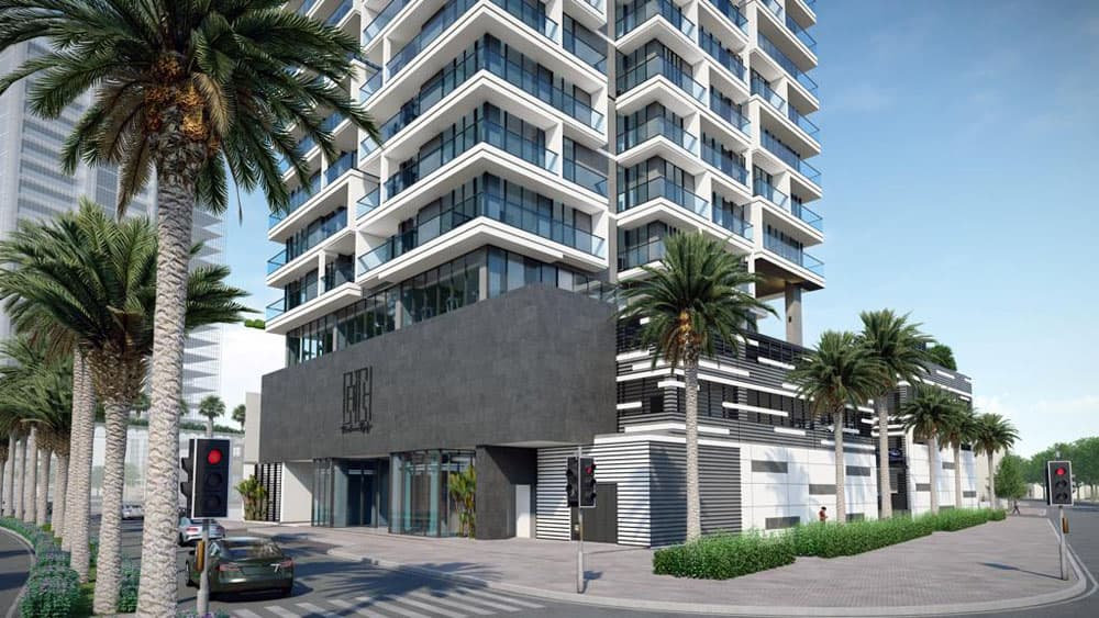Catch Residences” הוא בניין מודרני רב-קומתי עם מרפסות זכוכית, המוקף בעצי דקל וצמחייה, הממוקם בצומת רחובות. מכונית מחכה ברמזור אדום תחת שמיים כחולים וצלולים. Catch Residences" הוא בניין מודרני רב-קומתי עם מרפסות זכוכית, המוקף בעצי דקל וצמחייה, הממוקם בצומת רחובות. מכונית מחכה ברמזור אדום תחת שמיים כחולים וצלולים.