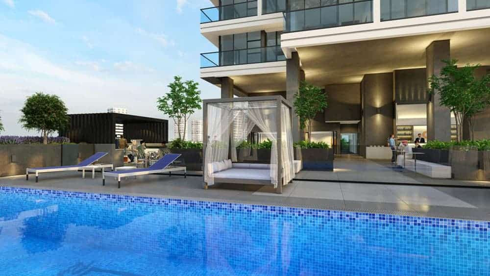 אזור בריכה חיצוני מודרני ב-Catch Residences, עם מים המרוצפים באריחים כחולים, כסאות נוח, בקתה עם וילונות שקופים, עציצים, ובניין עכשווי ברקע תחת שמיים מעוננים חלקית. אזור בריכה חיצוני מודרני ב-Catch Residences, עם מים המרוצפים באריחים כחולים, כסאות נוח, בקתה עם וילונות שקופים, עציצים, ובניין עכשווי ברקע תחת שמיים מעוננים חלקית.