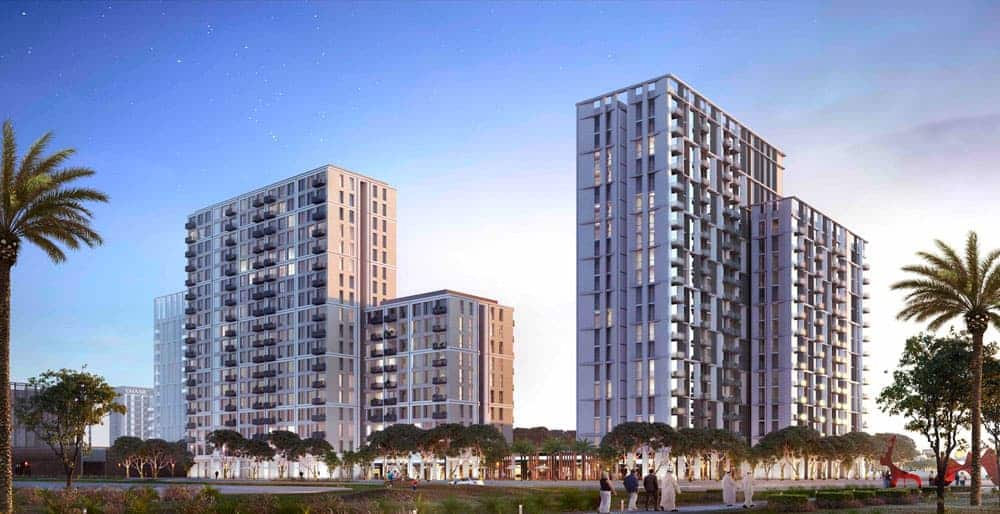 בנייני מגורים מודרניים רבי קומות עם מרפסות וחלונות גדולים, מוקפים בעצי דקל וצמחייה בשעת בין ערביים בדובאי הילס. אנשים מטיילים בשביל ליד Collective 2.0, נהנים מהאווירה השלווה תחת שמיים בהירים. בנייני מגורים מודרניים רבי קומות עם מרפסות וחלונות גדולים, מוקפים בעצי דקל וצמחייה בשעת בין ערביים בדובאי הילס. אנשים מטיילים בשביל ליד Collective 2.0, נהנים מהאווירה השלווה תחת שמיים בהירים.