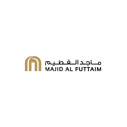הלוגו של Majid Al Futtaim, הכולל סמל M מוזהב ומעוצב בצד שמאל ושם החברה בערבית ובאנגלית בצד ימין, על רקע אפור בהיר — נפוץ בקהילות Tilal Al Ghaf ו-Alaya. הלוגו של Majid Al Futtaim, הכולל סמל M מוזהב ומעוצב בצד שמאל ושם החברה בערבית ובאנגלית בצד ימין, על רקע אפור בהיר — נפוץ בקהילות Tilal Al Ghaf ו-Alaya.