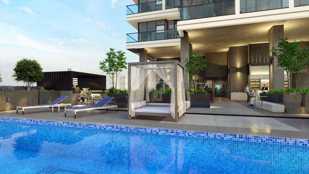 אזור הבריכה החיצוני המודרני ב-Catch Residences כולל מים כחולים, כסאות נוח, מיטת אפריון עם וילונות שקופים, עציצים, וברקע מבנה עכשווי עם מרפסות וחלונות גדולים. אזור הבריכה החיצוני המודרני ב-Catch Residences כולל מים כחולים, כסאות נוח, מיטת אפריון עם וילונות שקופים, עציצים, וברקע מבנה עכשווי עם מרפסות וחלונות גדולים.