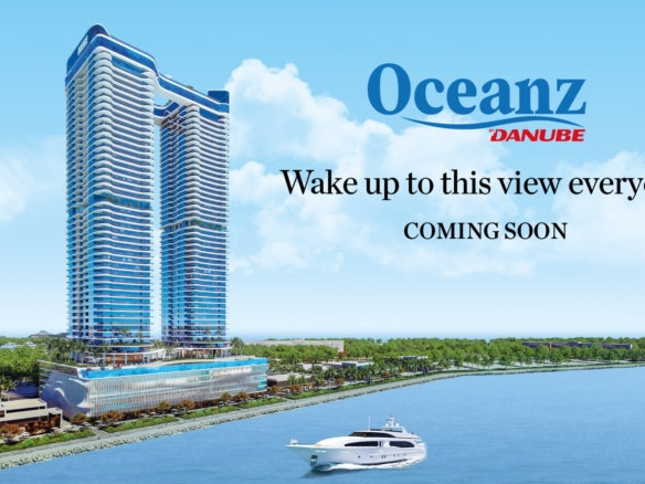 בניין רב-קומות מודרני על קו המים, הנושא את השם Oceanz by Danube, עם יאכטה על המים וכיתוב: "תתעוררו לנוף הזה כל בוקר". בקרוב.