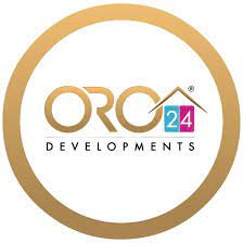 לוגו עבור ORO24 Developments. הכיתוב “ORO” בצבע זהב, המספר “24” מופיע בתוך ריבוע ורוד וכחול עם צורה של גג מעליו, והמילה “DEVELOPMENTS” כתובה מתחת. הכל מוקף במסגרת עגולה בצבע זהב. לוגו עבור ORO24 Developments. הכיתוב "ORO" בצבע זהב, המספר "24" מופיע בתוך ריבוע ורוד וכחול עם צורה של גג מעליו, והמילה "DEVELOPMENTS" כתובה מתחת. הכל מוקף במסגרת עגולה בצבע זהב.
