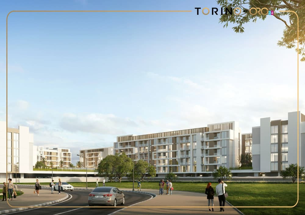 בנייני דירות מודרניים של ORO24, בעלי חזיתות לבנות, משתרעים לאורך רחוב מתעקל בטורינו, שבו מטיילים הולכים ומכוניות נוסעות. עצים ושמיים בהירים משלימים את התמונה העירונית והעכשווית. בנייני דירות מודרניים של ORO24, בעלי חזיתות לבנות, משתרעים לאורך רחוב מתעקל בטורינו, שבו מטיילים הולכים ומכוניות נוסעות. עצים ושמיים בהירים משלימים את התמונה העירונית והעכשווית.
